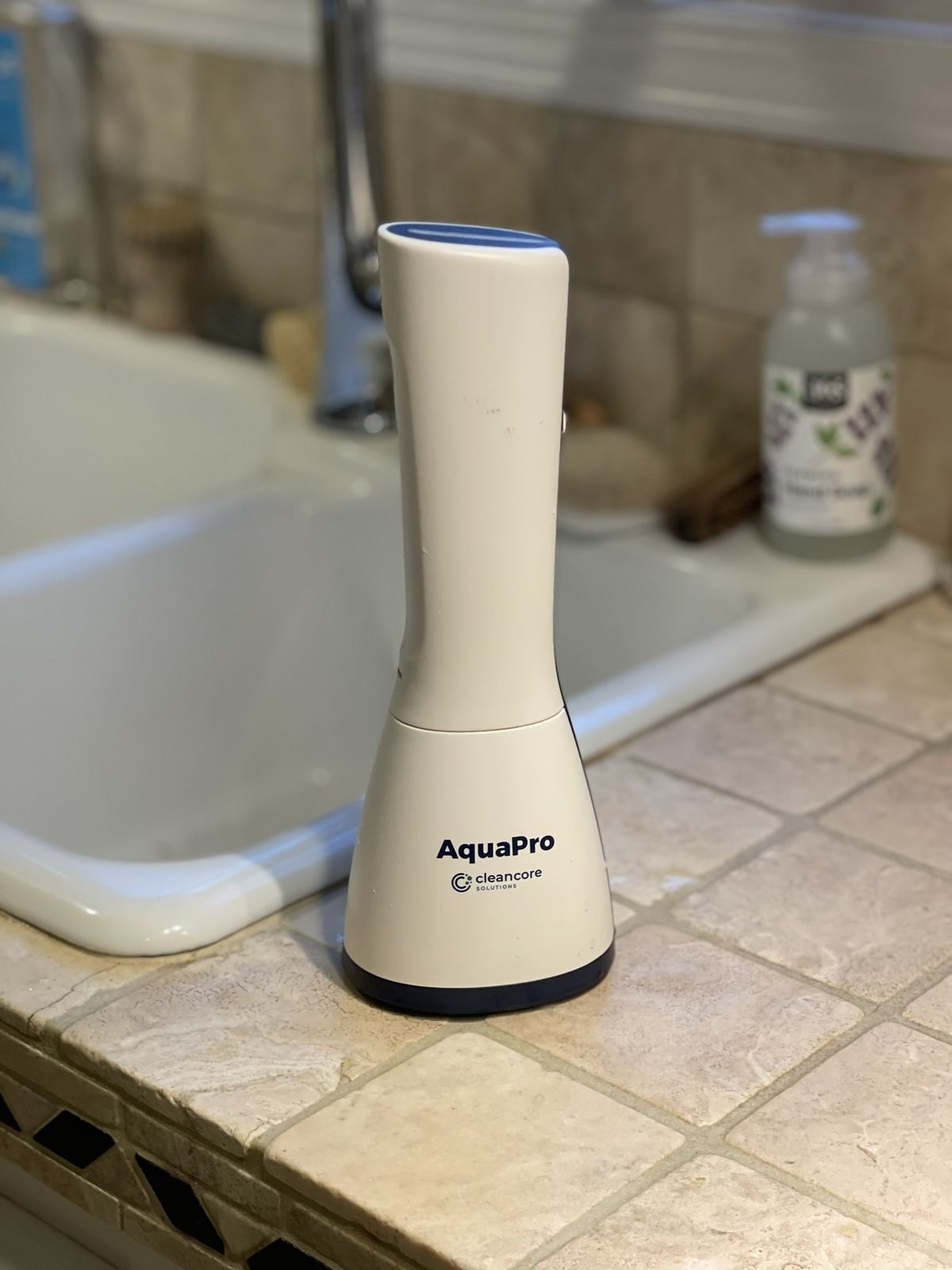 AquaPro on a tile counter beside a kitchen sink
